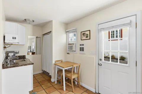 a kitchen with a refrigerator and cabinets