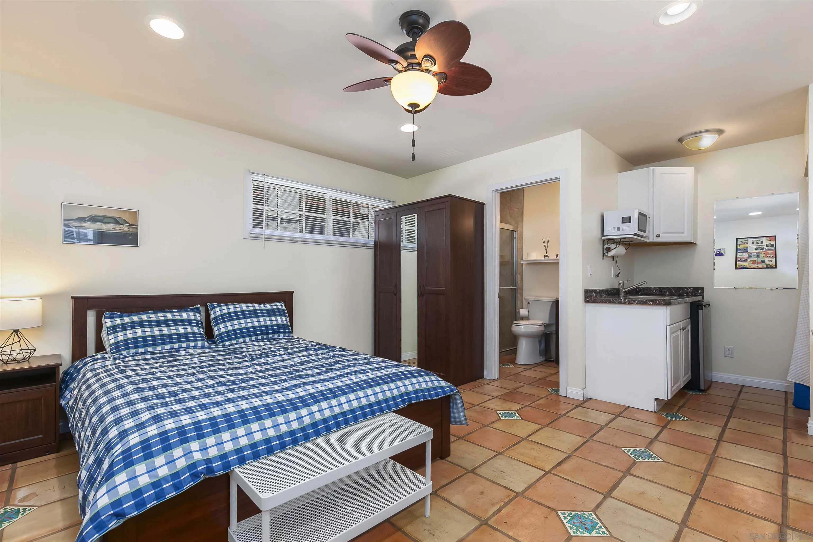 2544 Juan Street San Diego, CA 92110 - Photo 10 of 54 a bedroom with a bed and a refrigerator