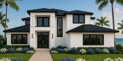 a front view of a house with a yard and potted plants