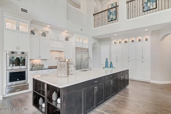 a kitchen with a sink and cabinets