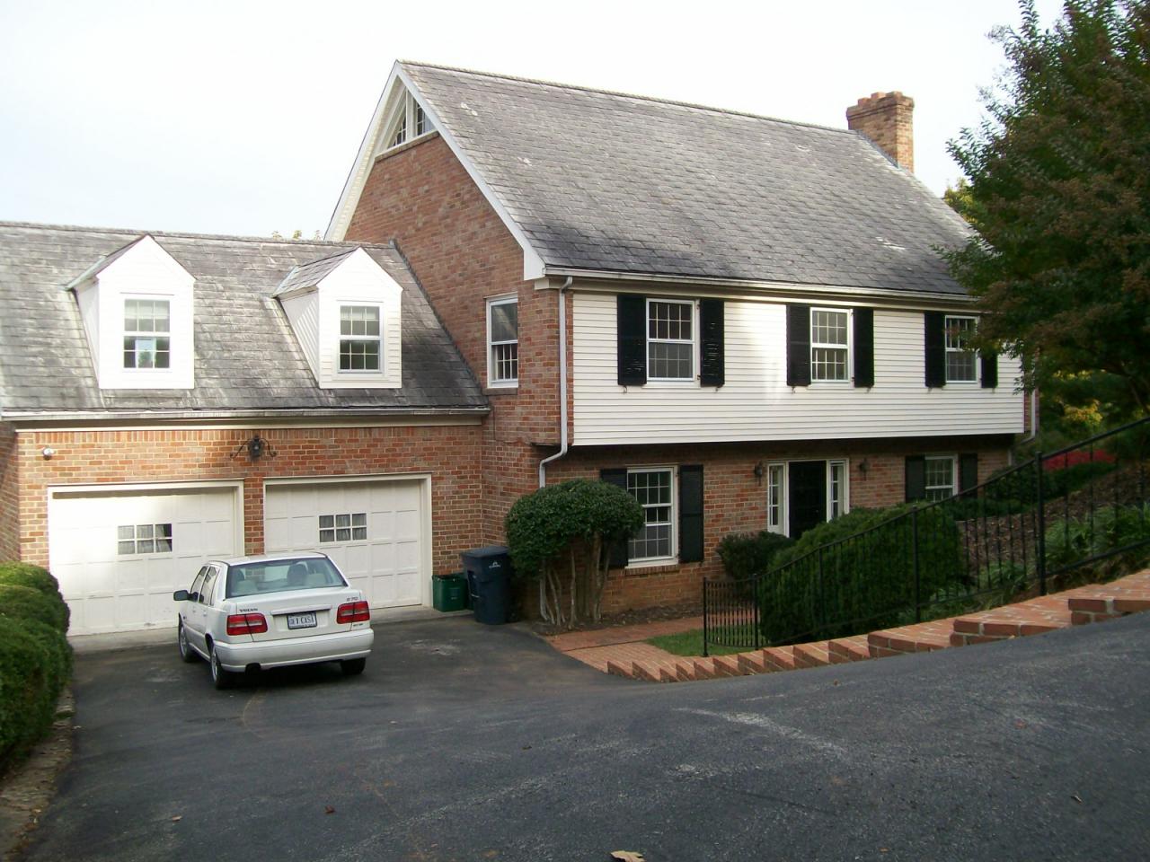 3434 West Ridge Road Southwest Roanoke, VA 24014 - Photo 1 of 16 a front view of a house with a yard and garage