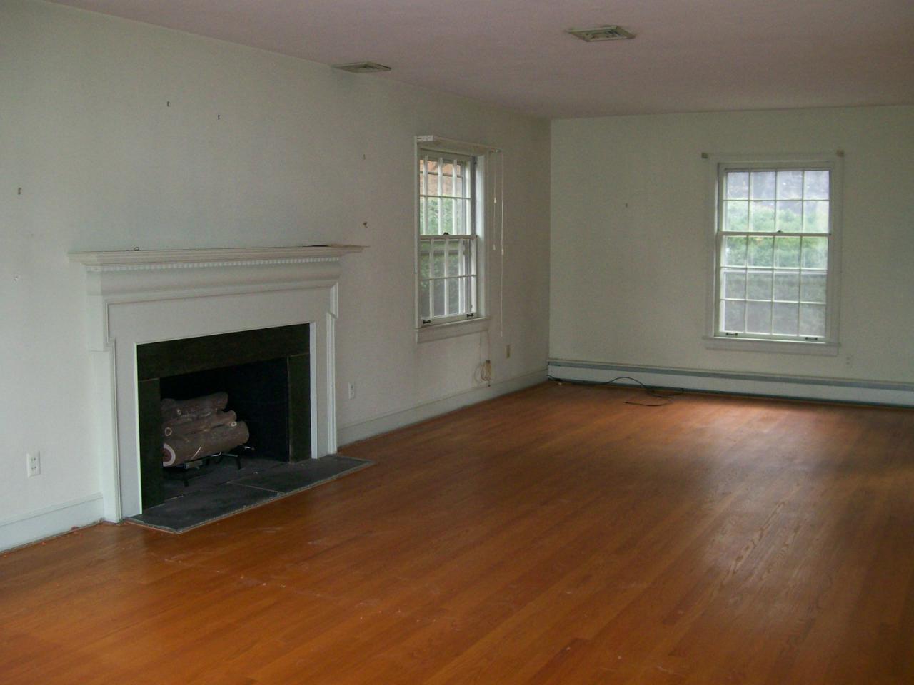 3434 West Ridge Road Southwest Roanoke, VA 24014 - Photo 8 of 16 an empty room with windows and fireplace