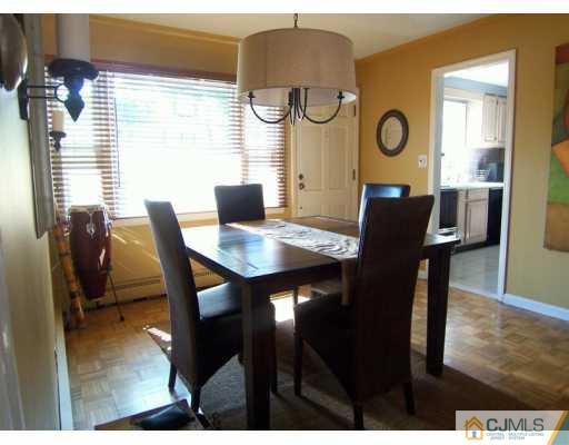 168 South Hill Road Colonia, NJ 07067 - Photo 3 of 8 a view of a dining room with furniture and a window