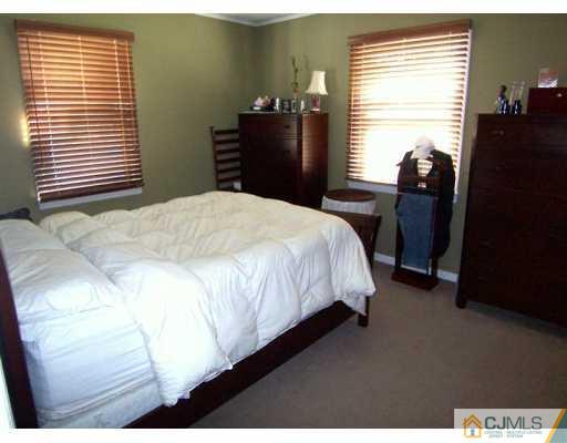 168 South Hill Road Colonia, NJ 07067 - Photo 5 of 8 a bedroom with a bed and a window