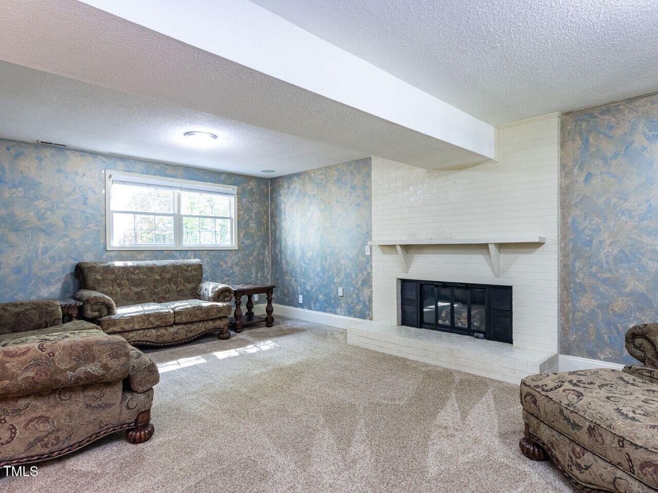 525 Turtle Creek Farm Road Apex, NC 27523 - Photo 16 of 36 a living room with furniture and a fireplace