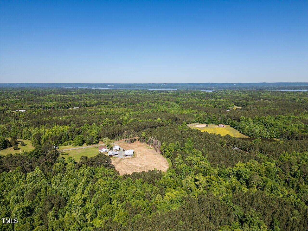 525 Turtle Creek Farm Road Apex, NC 27523 - Photo 24 of 36 a view of a lake with a city