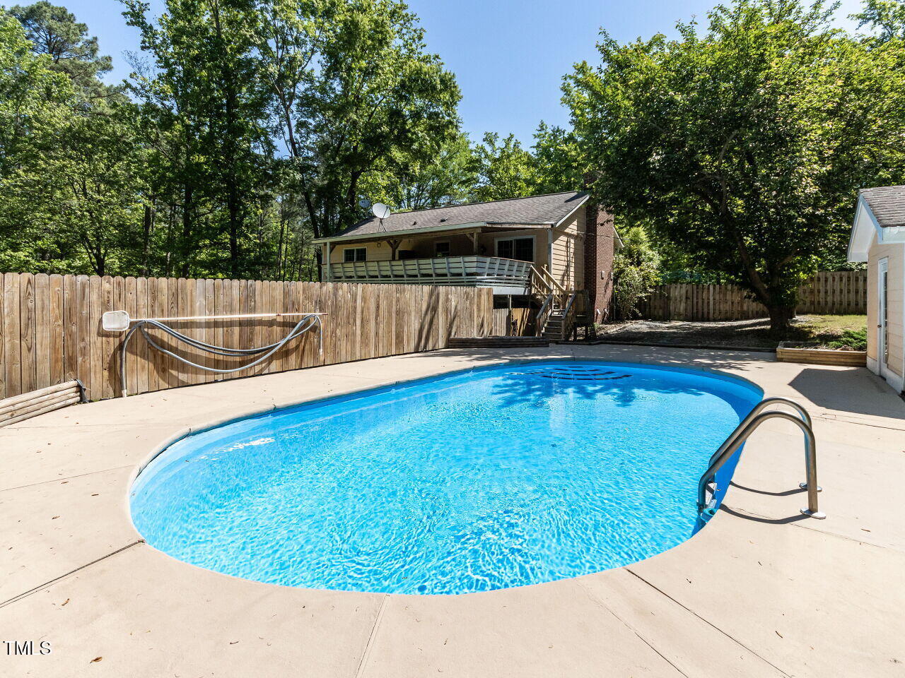 525 Turtle Creek Farm Road Apex, NC 27523 - Photo 3 of 36 a view of swimming pool with a backyard