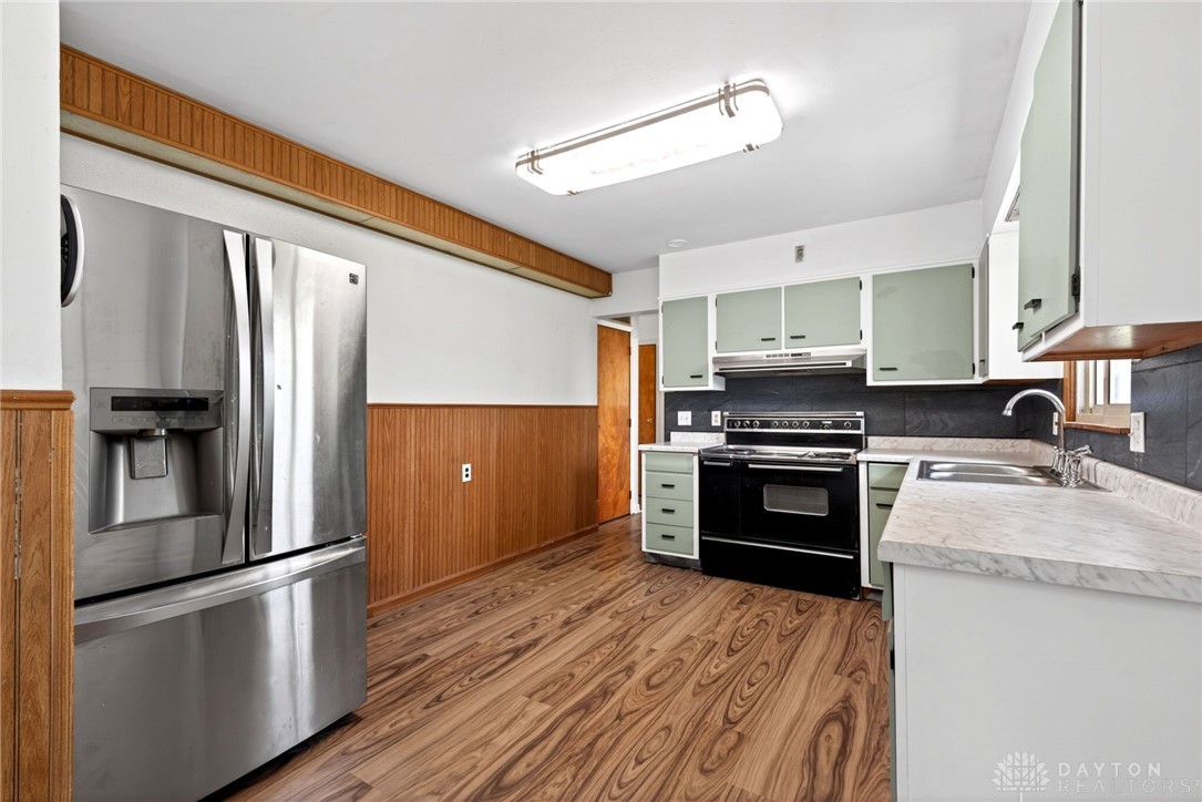 1005 Free Road New Carlisle, OH 45344 - Photo 14 of 43 This spacious kitchen offers ample room for culinary creativity and gatherings.