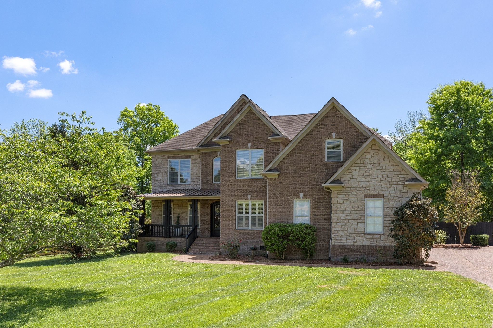 4409 Savage Pointe Drive Franklin, TN 37064 - Photo 2 of 70 a front view of a house with a yard