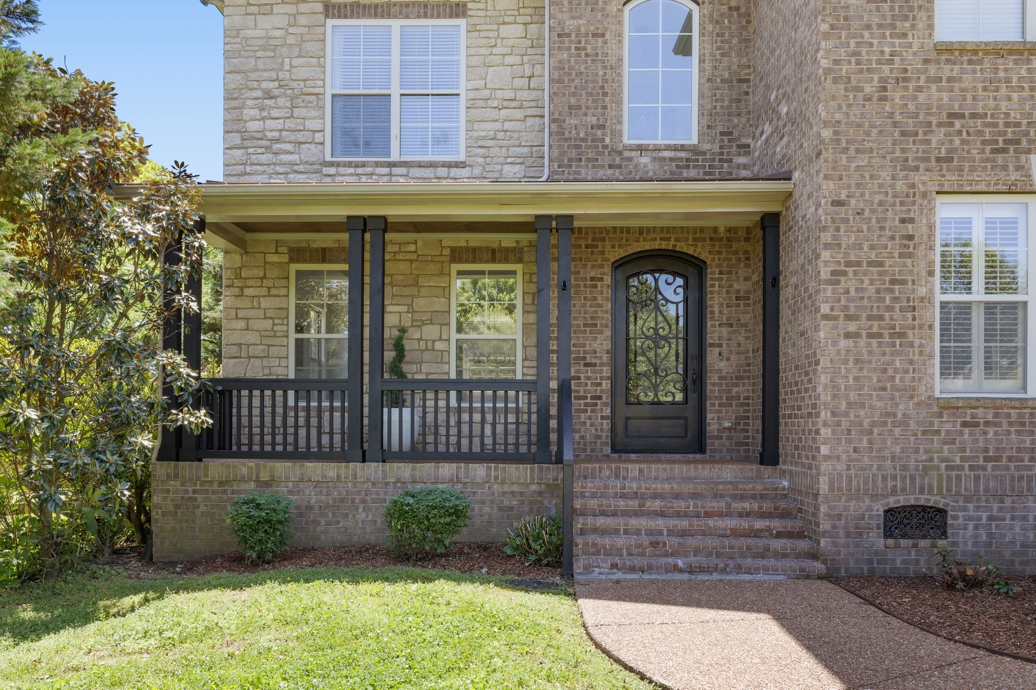4409 Savage Pointe Drive Franklin, TN 37064 - Photo 3 of 70 a front view of a house with a garden