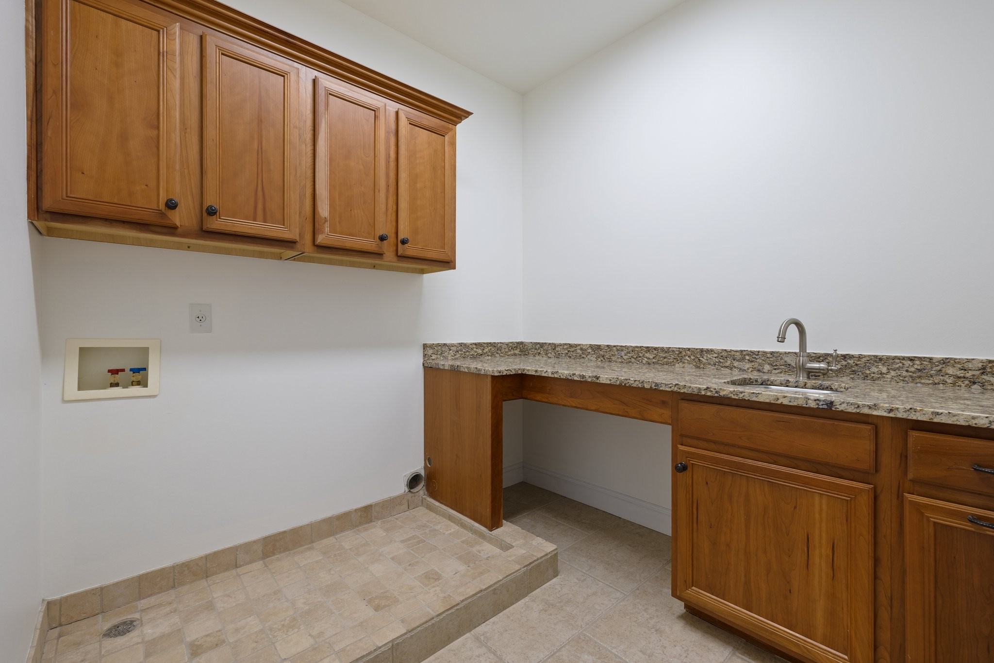 4409 Savage Pointe Drive Franklin, TN 37064 - Photo 41 of 70 a room with granite countertop cabinets and sink