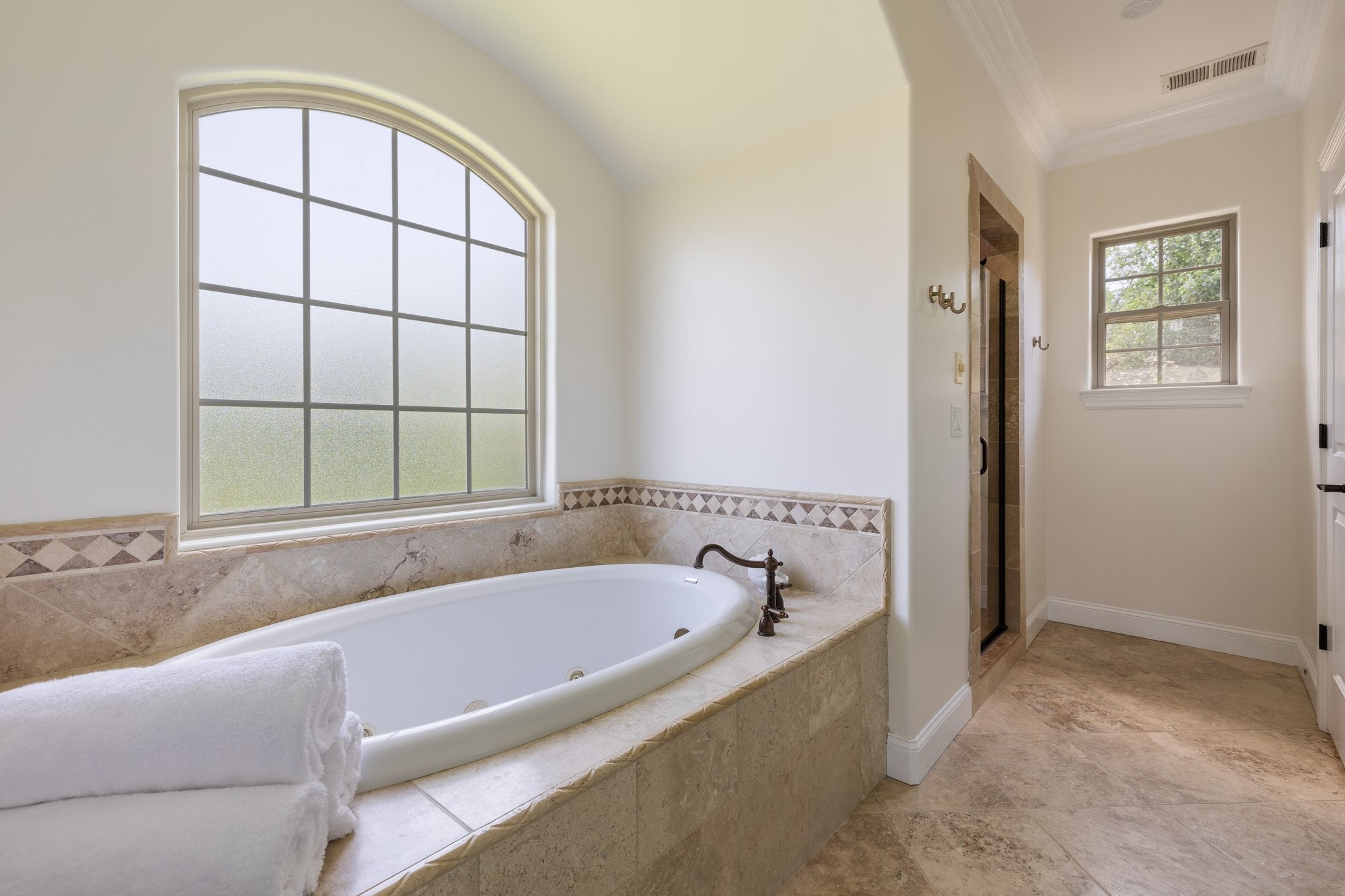 4409 Savage Pointe Drive Franklin, TN 37064 - Photo 54 of 70 a bathroom with a bathtub and next to a window