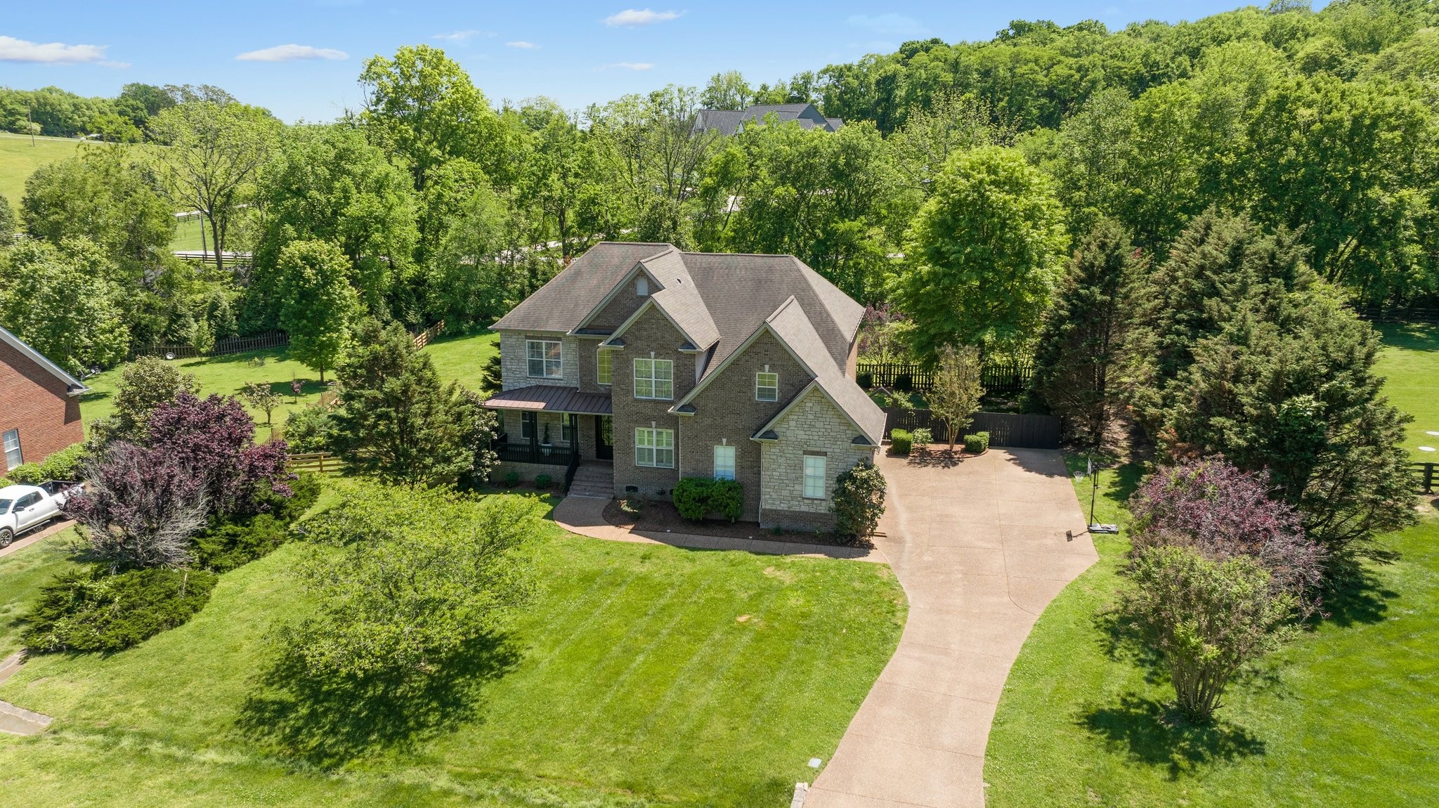 4409 Savage Pointe Drive Franklin, TN 37064 - Photo 63 of 70 a view of a house with a big yard plants and large trees