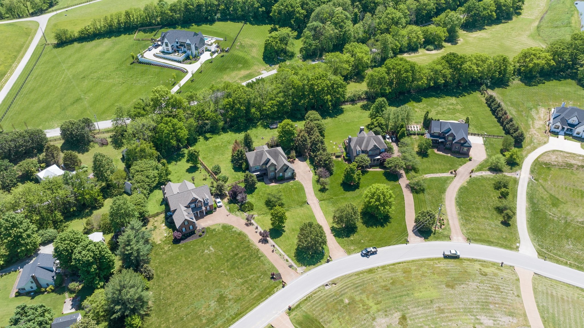 4409 Savage Pointe Drive Franklin, TN 37064 - Photo 67 of 70 an aerial view of a house with a yard and large trees
