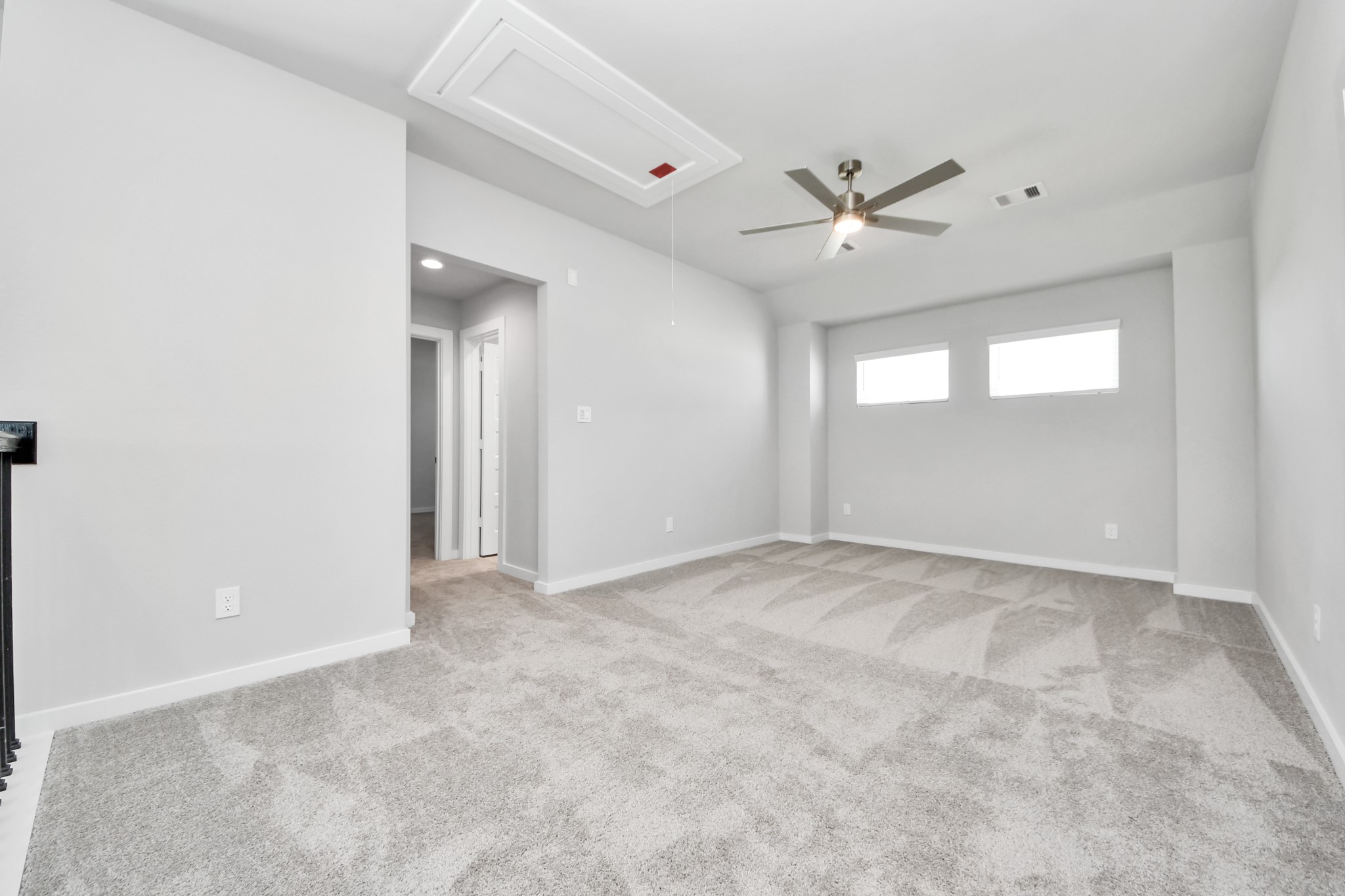 2910 Burris Park Drive Spring, TX 77373 - Photo 26 of 34 Discover a haven of leisure in this fantastic game room! Whether you're seeking a casual hangout or an adult gaming retreat, this space has it all. Enjoy the luxurious feel of plush carpet underfoot, the expansive ambiance of high ceilings, custom paint that adds a touch of personality, and windows that flood the room with refreshing natural light. Sample photo of completed home with similar floor plan. Actual colors and selections may vary.