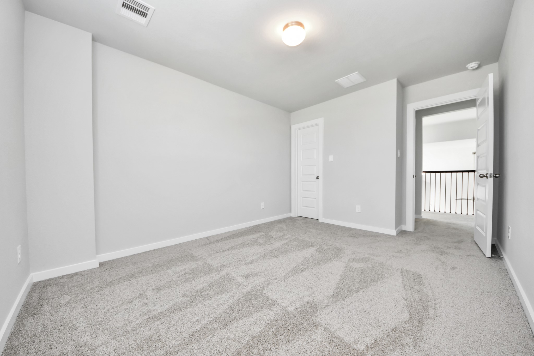 2910 Burris Park Drive Spring, TX 77373 - Photo 27 of 34 Generously sized secondary bedrooms featuring spacious closets, soft and inviting carpeting underfoot, large windows allowing plenty of natural light, and the added touch of privacy blinds for your personal retreat. Sample photo of completed home with similar floor plan. Actual colors and selections may vary.