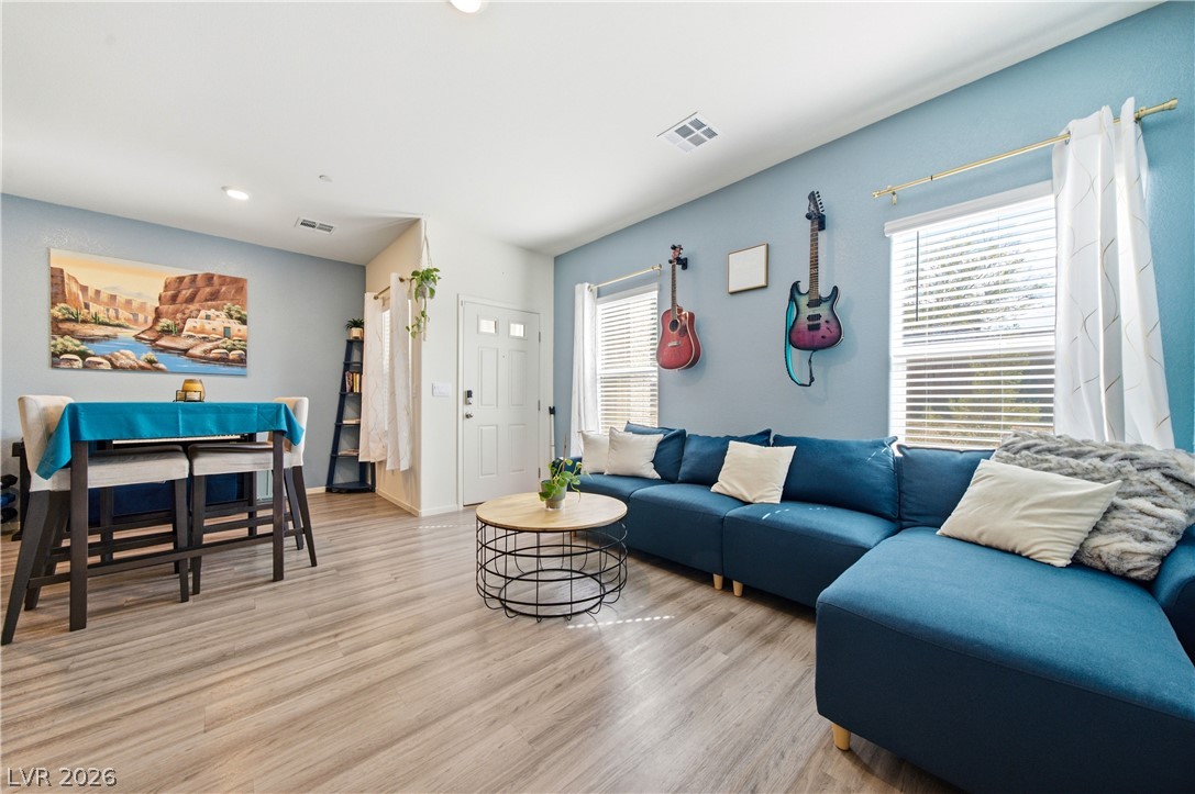 495 Blue Ridge Cove Henderson, NV 89002 - Photo 11 of 32 Sun-filled open-concept living space with resilient flooring.