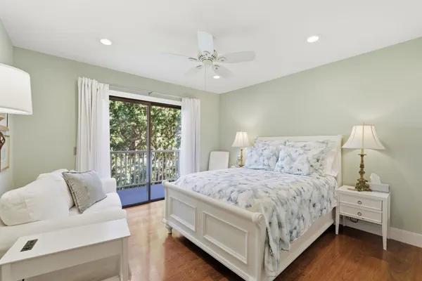 a bedroom with a bed and a couch