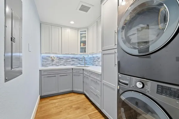 a bathroom with a sink mirror vanity and toilet