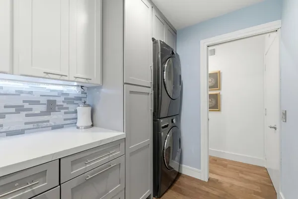 a kitchen with a refrigerator and a sink