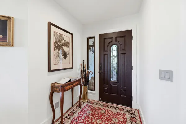 a view of a hallway with front door