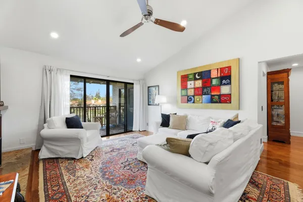 a living room with furniture or couch and a large window