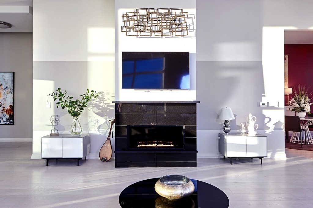 1 Franklin Street, Unit PH4E Boston, MA 02110 - Photo 11 of 30 a living room with furniture and a fireplace