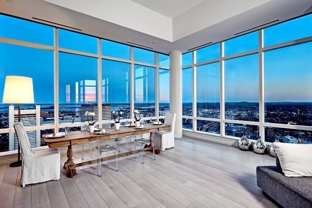 1 Franklin Street, Unit PH4E Boston, MA 02110 - Photo 12 of 30 a room with lots of furniture and a wooden floor