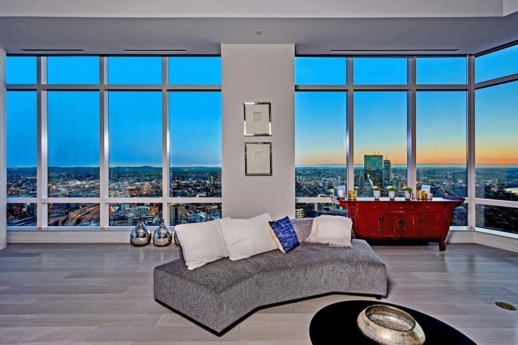 1 Franklin Street, Unit PH4E Boston, MA 02110 - Photo 14 of 30 a living room with furniture large window and wooden floor