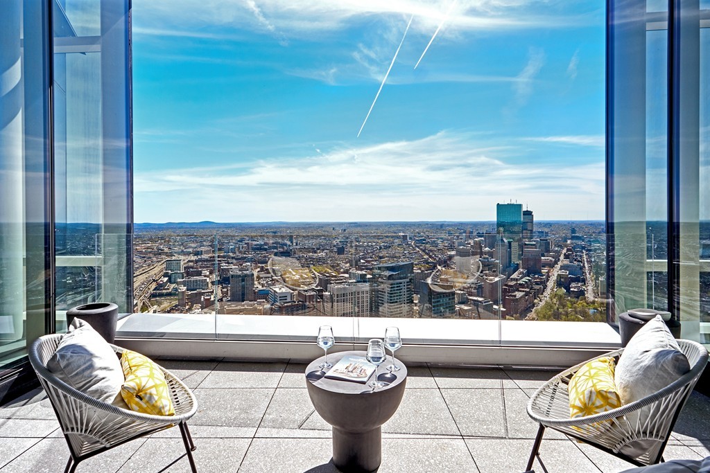 1 Franklin Street, Unit PH4E Boston, MA 02110 - Photo 2 of 30 a view of a chairs and table in the terrace