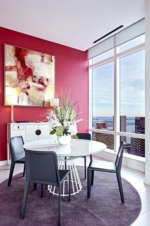 1 Franklin Street, Unit PH4E Boston, MA 02110 - Photo 6 of 30 a view of a dining room with furniture window and wooden floor