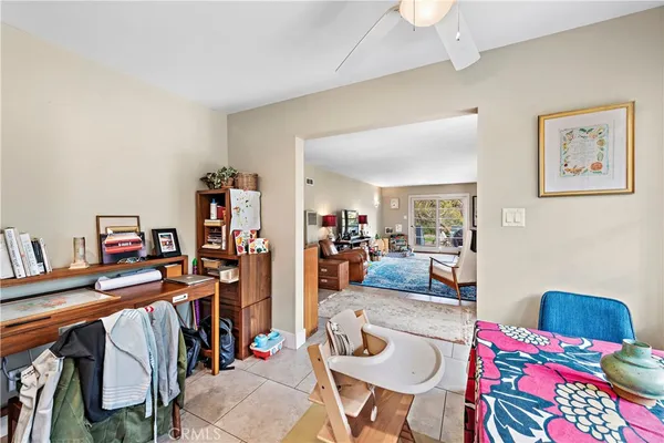 a bedroom with furniture and a book shelf