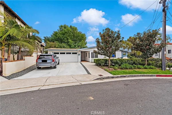 a view of garage with parked car