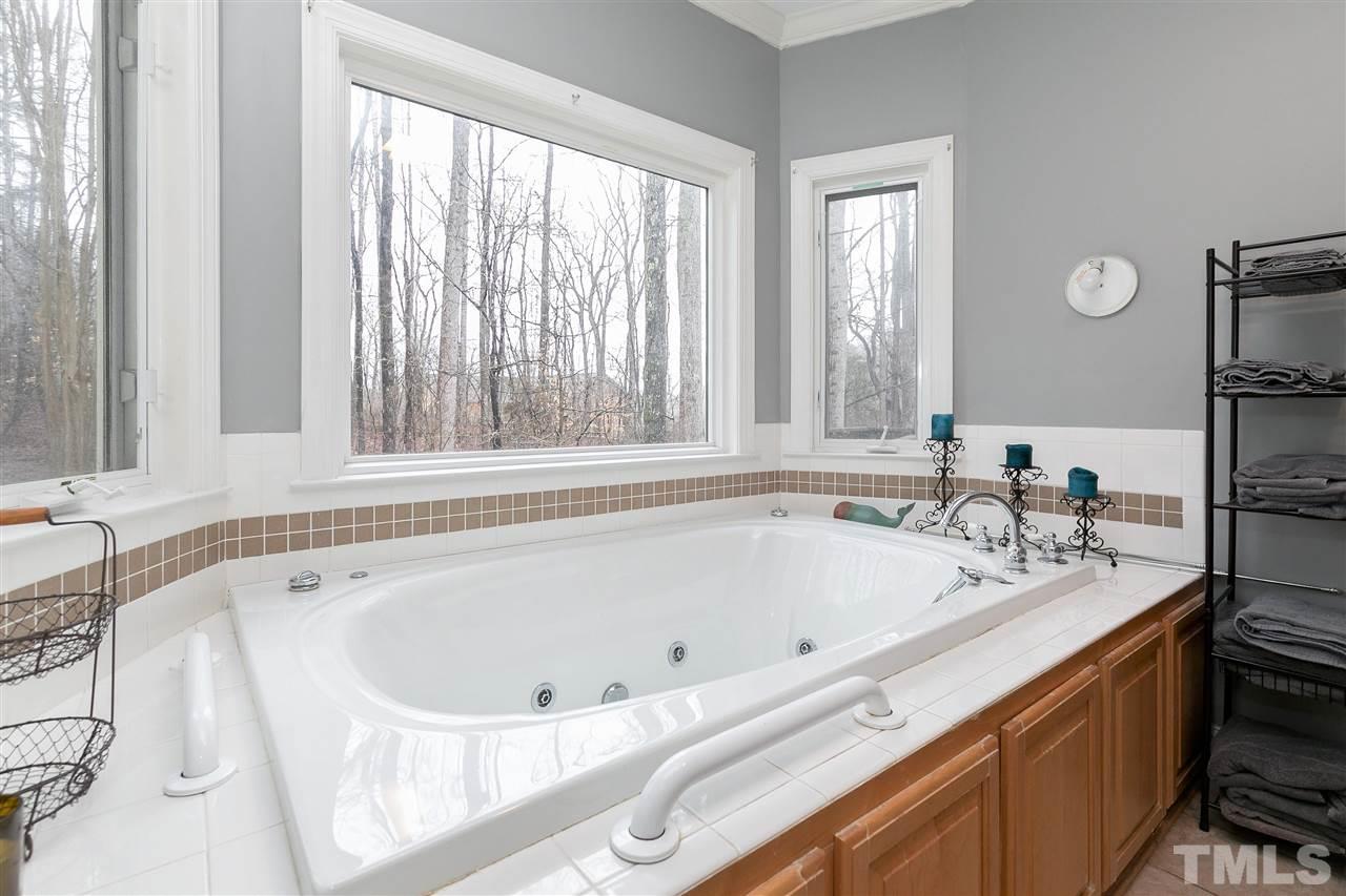 34 Gray Hawk Trail Rougemont, NC 27572 - Photo 14 of 30 a bath tub sitting in a bathroom next to a window