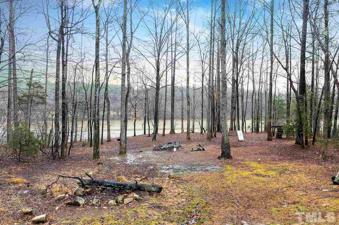 34 Gray Hawk Trail Rougemont, NC 27572 - Photo 22 of 30 a view of outdoor space with deck and trees