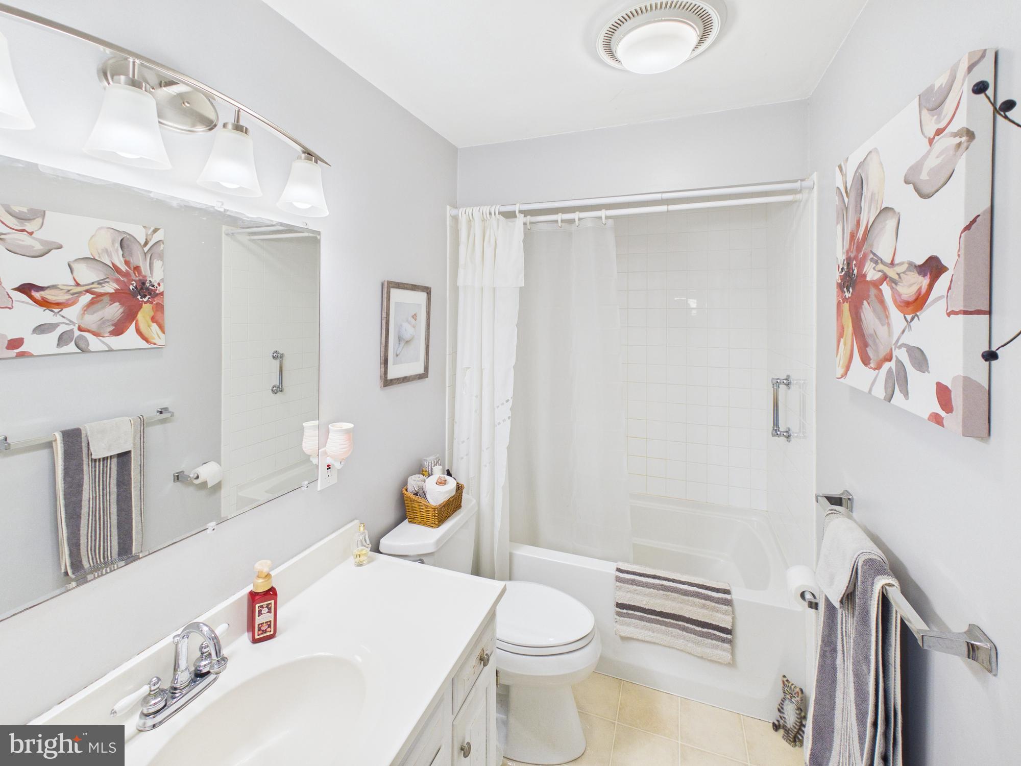 2175 River Road Washington Boro, PA 17582 - Photo 13 of 25 a bathroom with a sink a toilet and shower curtain