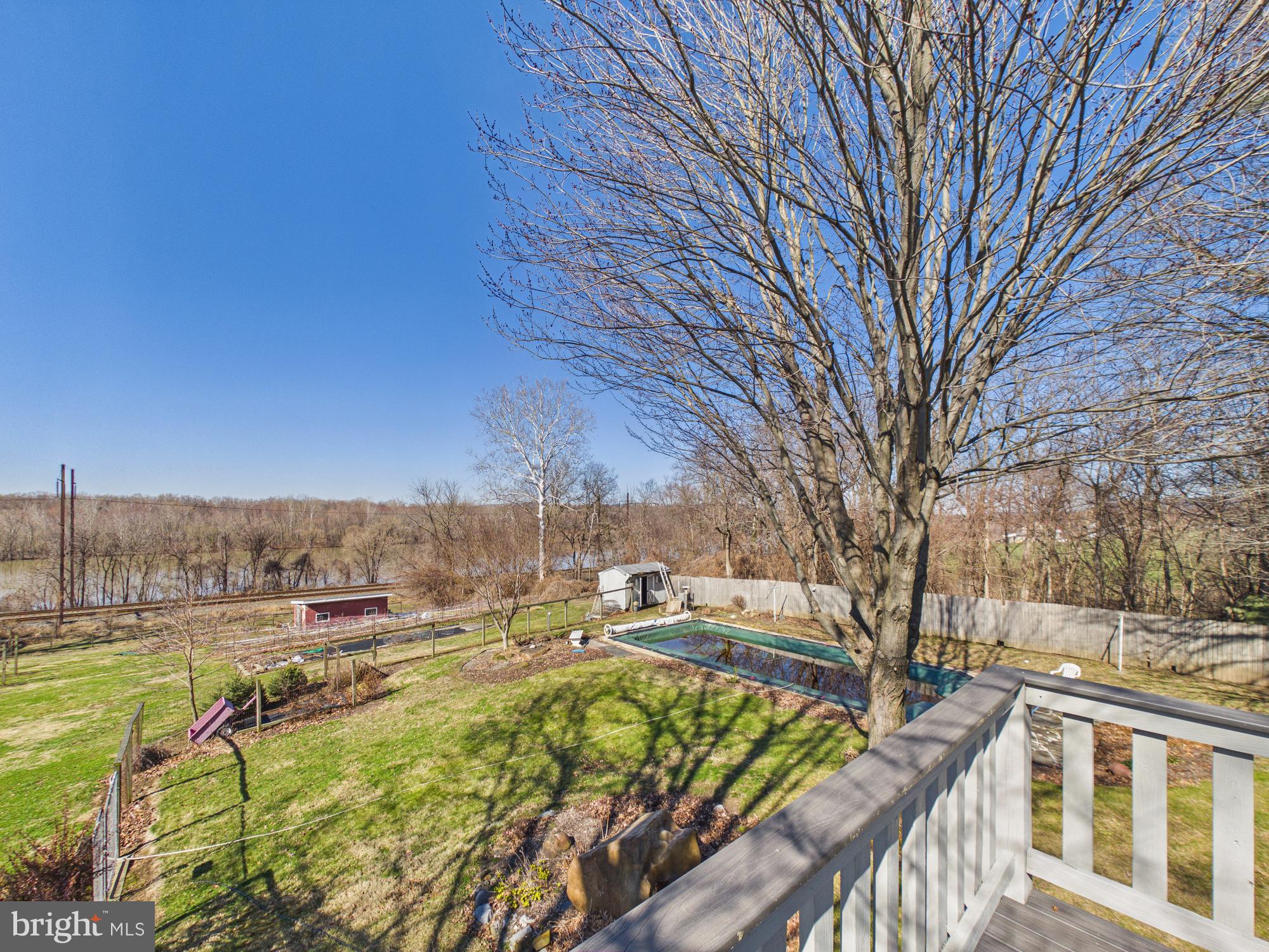 2175 River Road Washington Boro, PA 17582 - Photo 22 of 25 a view of a swimming pool with an outdoor seating and a yard