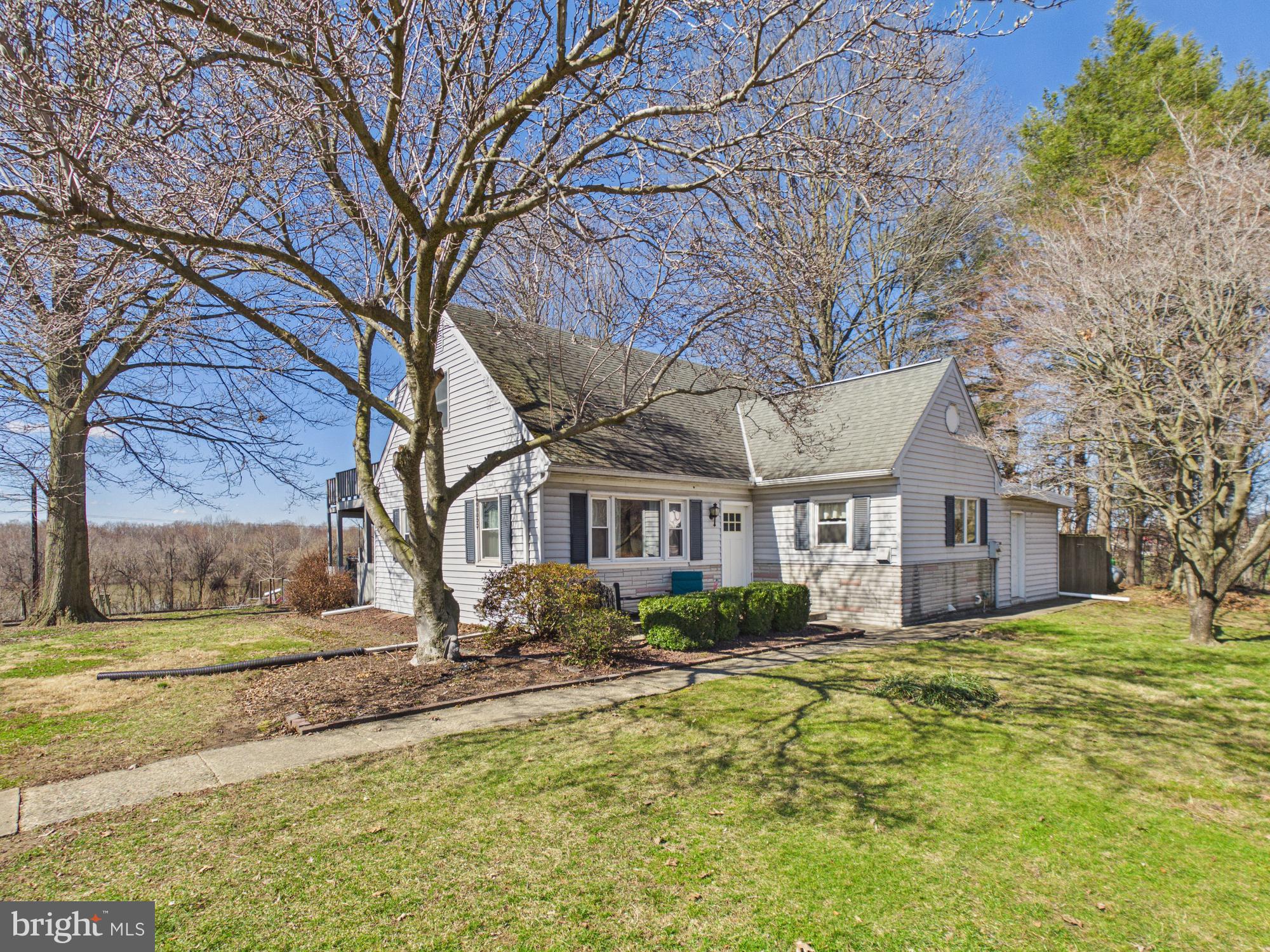 2175 River Road Washington Boro, PA 17582 - Photo 3 of 25 a front view of house with yard and trees around