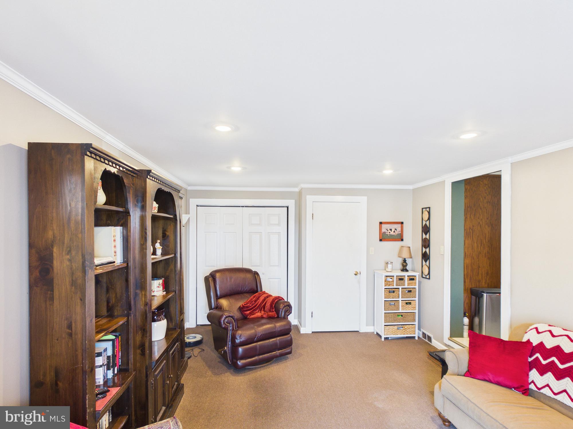 2175 River Road Washington Boro, PA 17582 - Photo 10 of 25 a living room with furniture and a book shelf