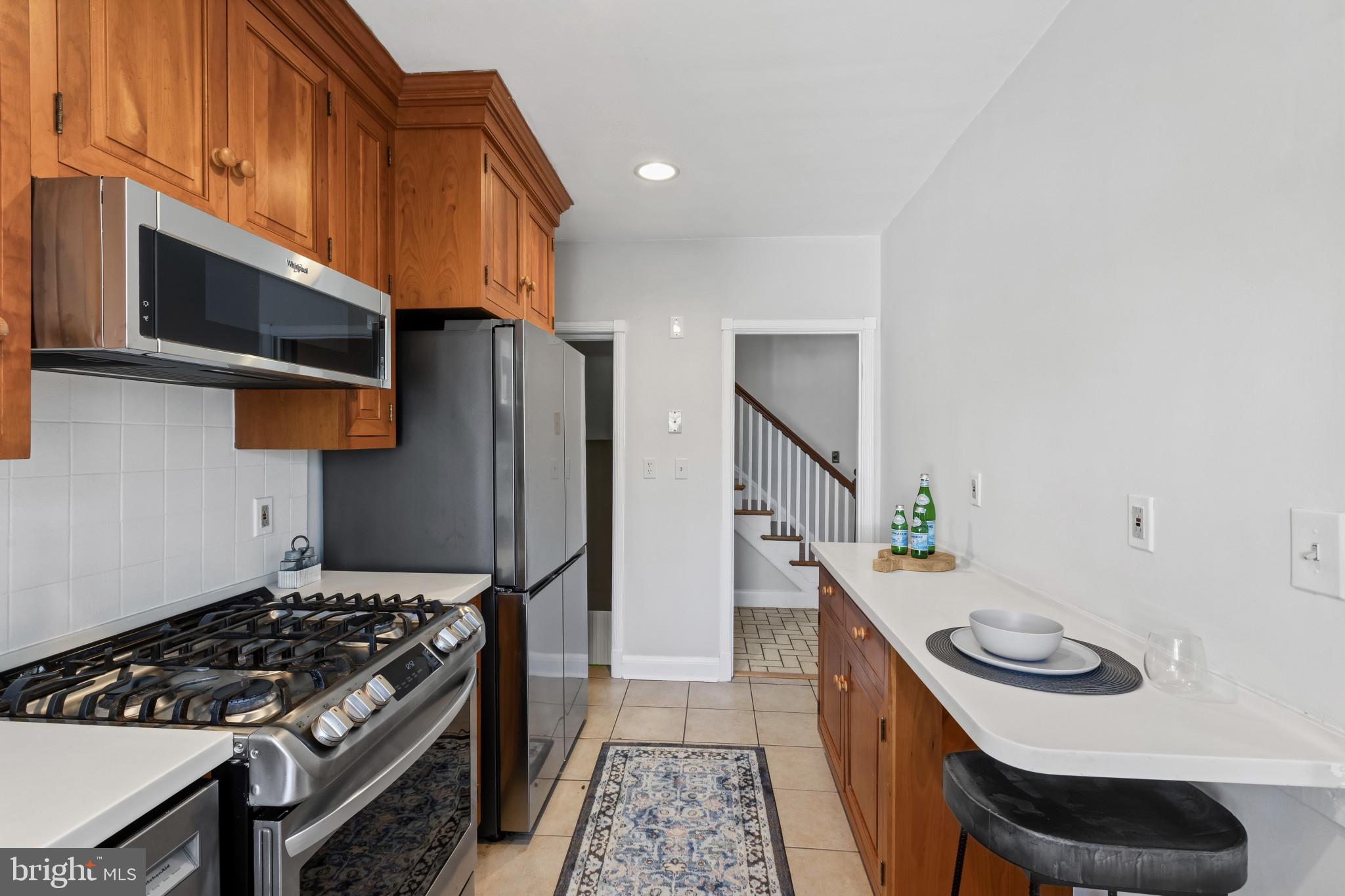 86 Dunkirk Road Baltimore, MD 21212 - Photo 13 of 52 a kitchen with a stove and a refrigerator