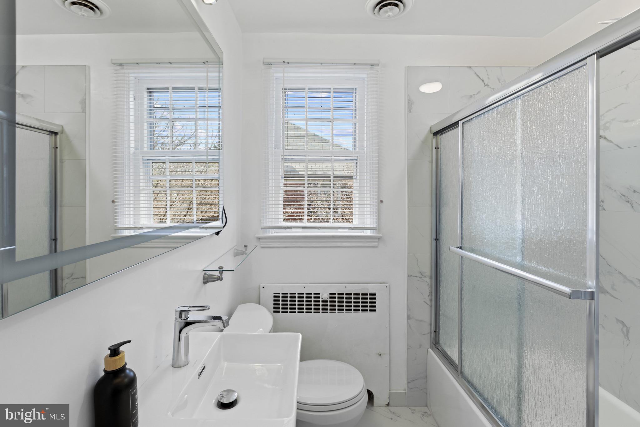 86 Dunkirk Road Baltimore, MD 21212 - Photo 21 of 52 a bathroom with a sink toilet and shower