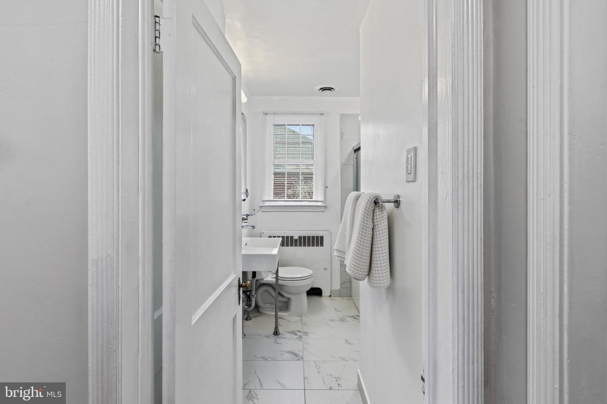 86 Dunkirk Road Baltimore, MD 21212 - Photo 22 of 52 a bathroom with a tub and a shower