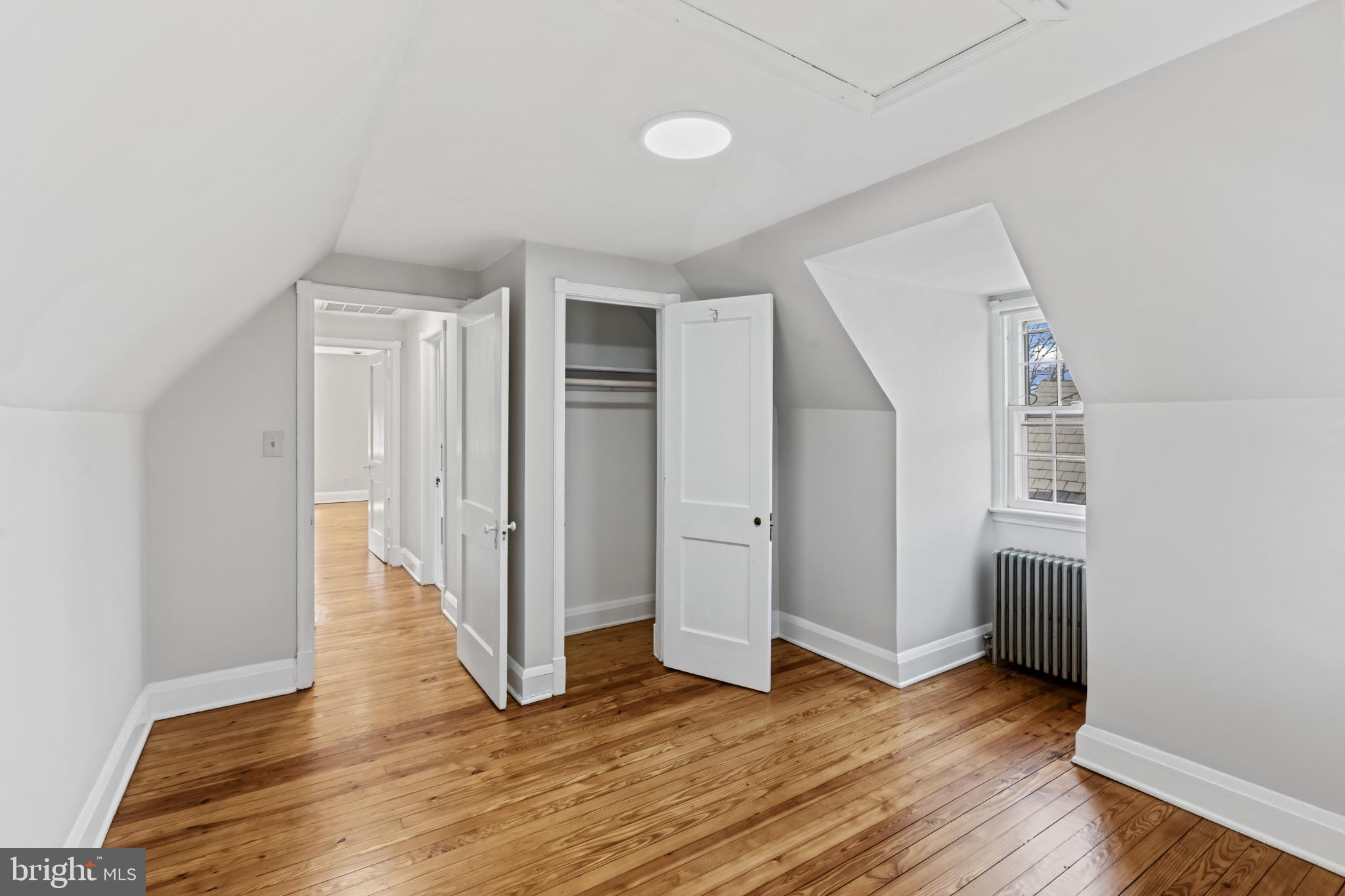 86 Dunkirk Road Baltimore, MD 21212 - Photo 25 of 52 an empty room with wooden floor and closet