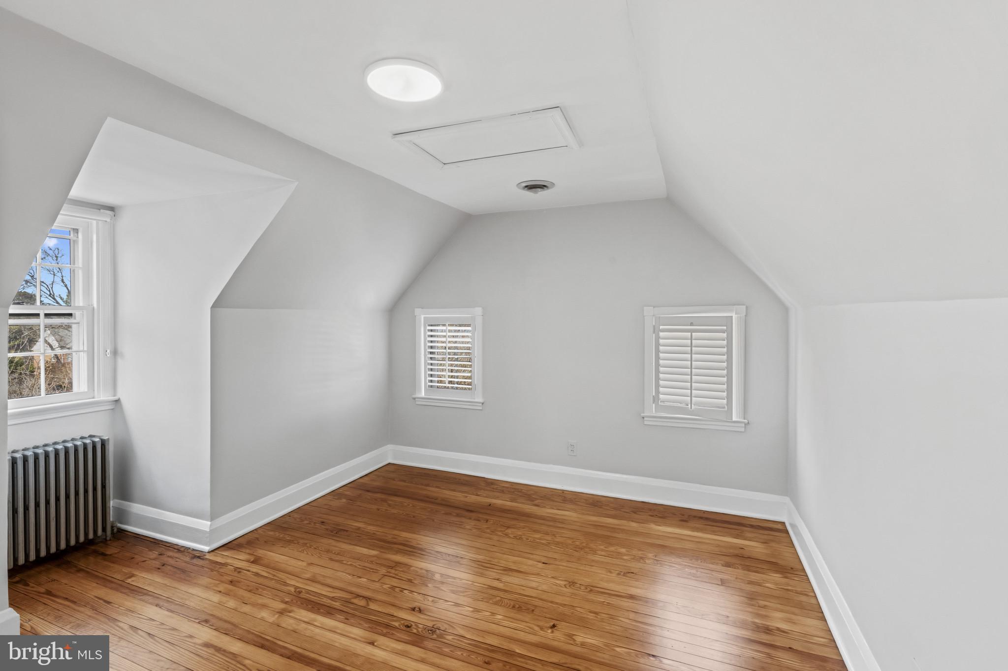 86 Dunkirk Road Baltimore, MD 21212 - Photo 26 of 52 an empty room with wooden floor and windows