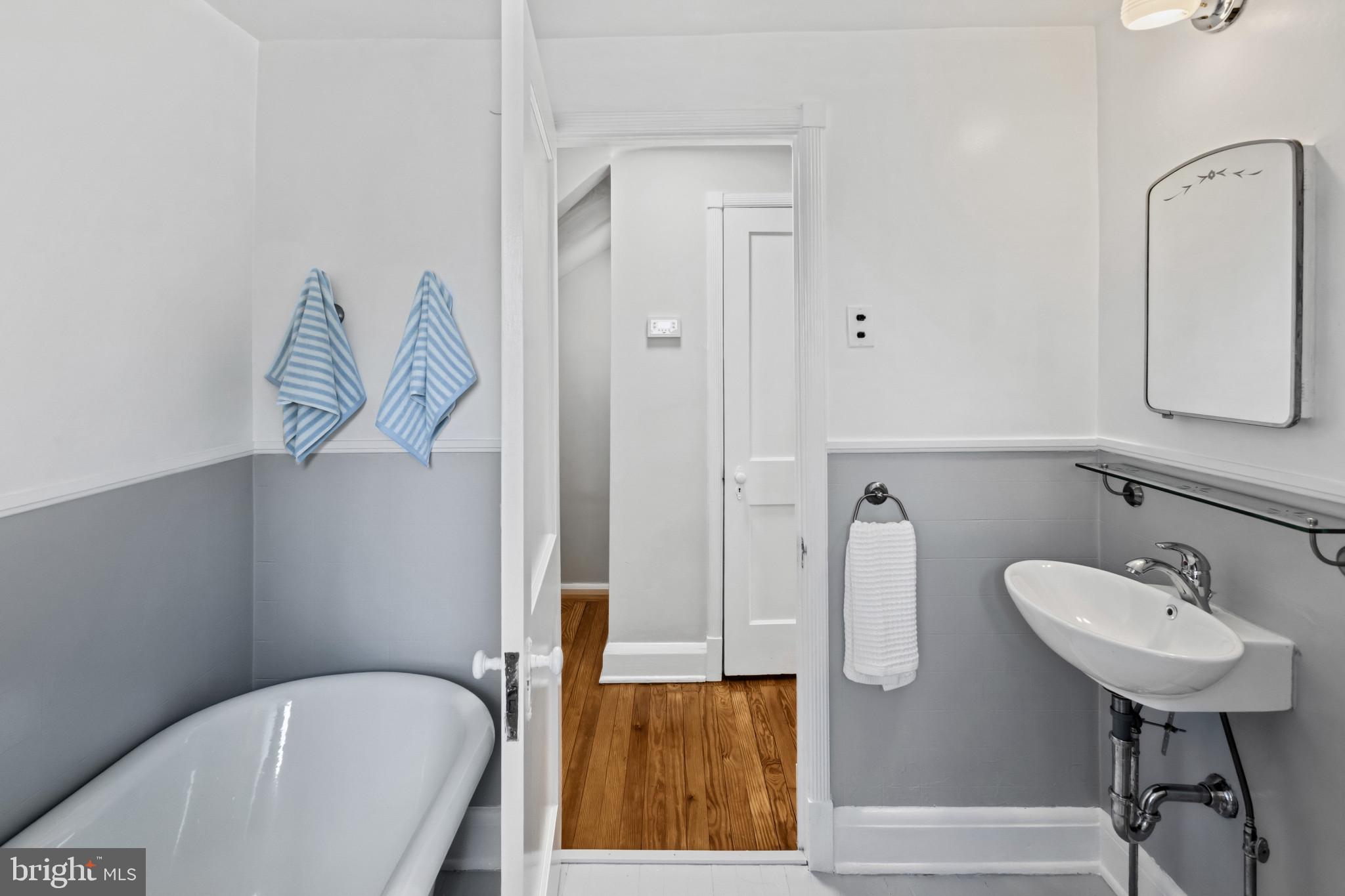 86 Dunkirk Road Baltimore, MD 21212 - Photo 29 of 52 a bathroom with a sink a toilet and shower