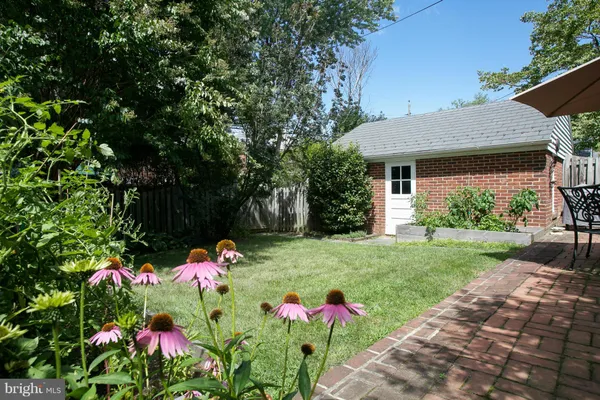 a front view of a house with trees