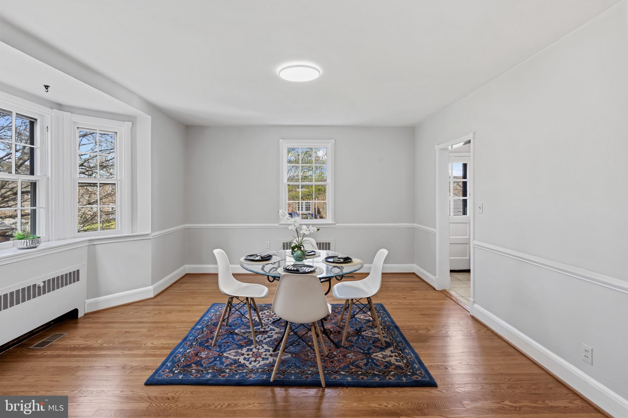 86 Dunkirk Road Baltimore, MD 21212 - Photo 8 of 52 a dining room with wooden floor and window