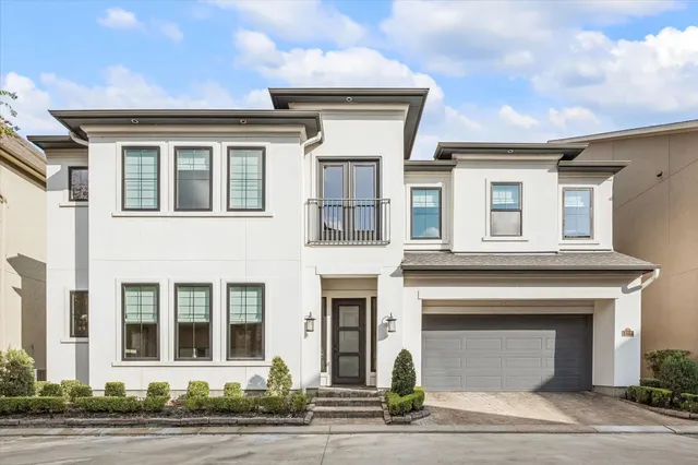 a front view of a house with a garage