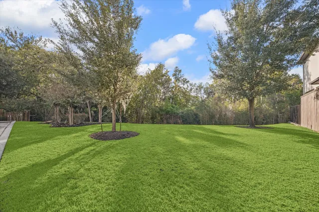 a view of a big yard with a fountain