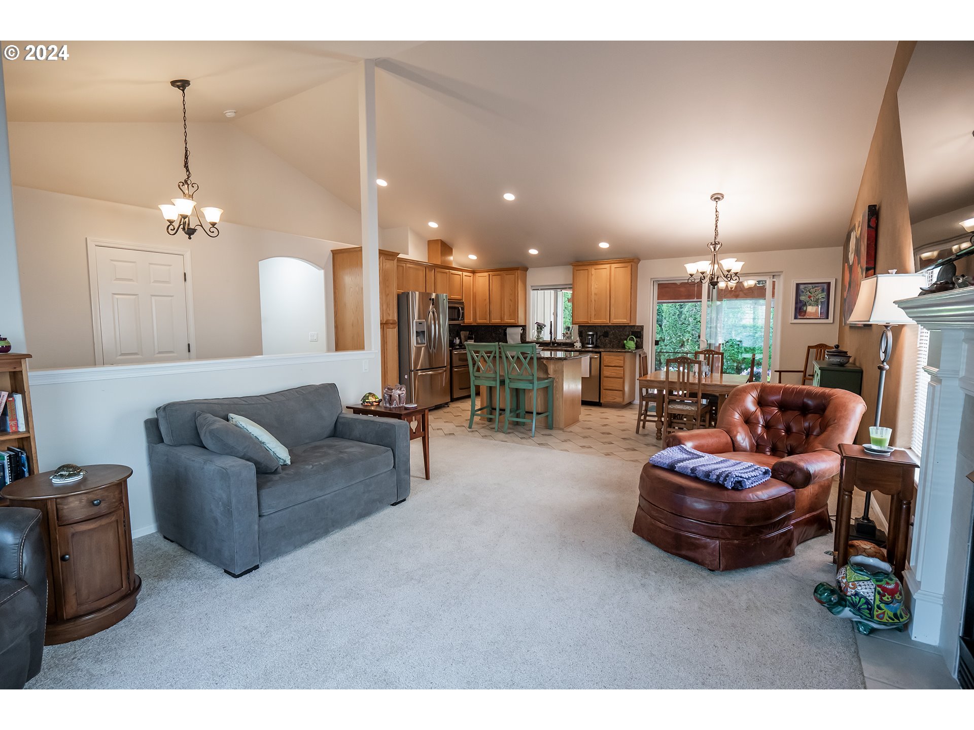 3582 Korbel Street Eugene, OR 97404 - Photo 2 of 32 a living room with furniture and a chandelier